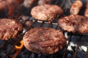 food meat - burgers on barbecue grill. Shallow dof.